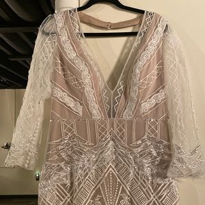 Wedding gown with nude illusion. Beading and crystals with gorgeous design work.